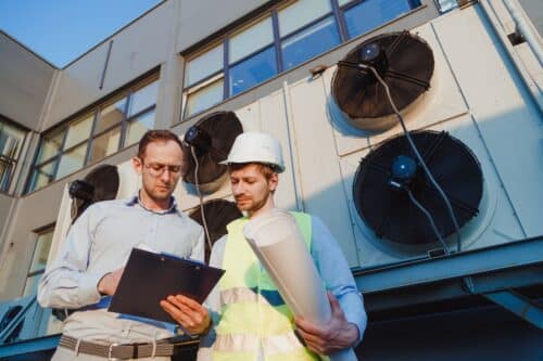 Engineers inspecting a chiller